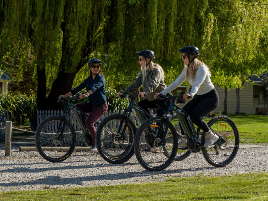 Riding e-bikes through Arrowtown.